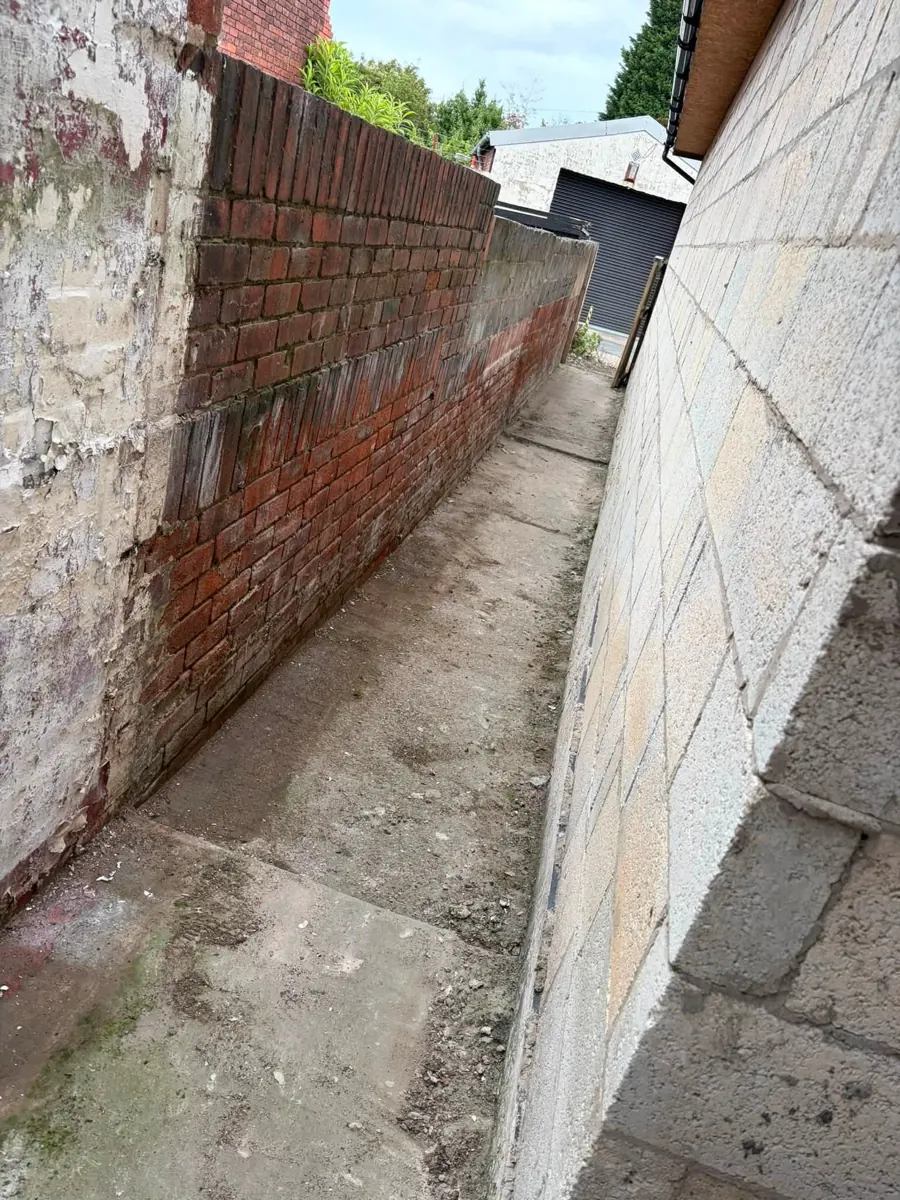 Side passage cleared of overgrowth
