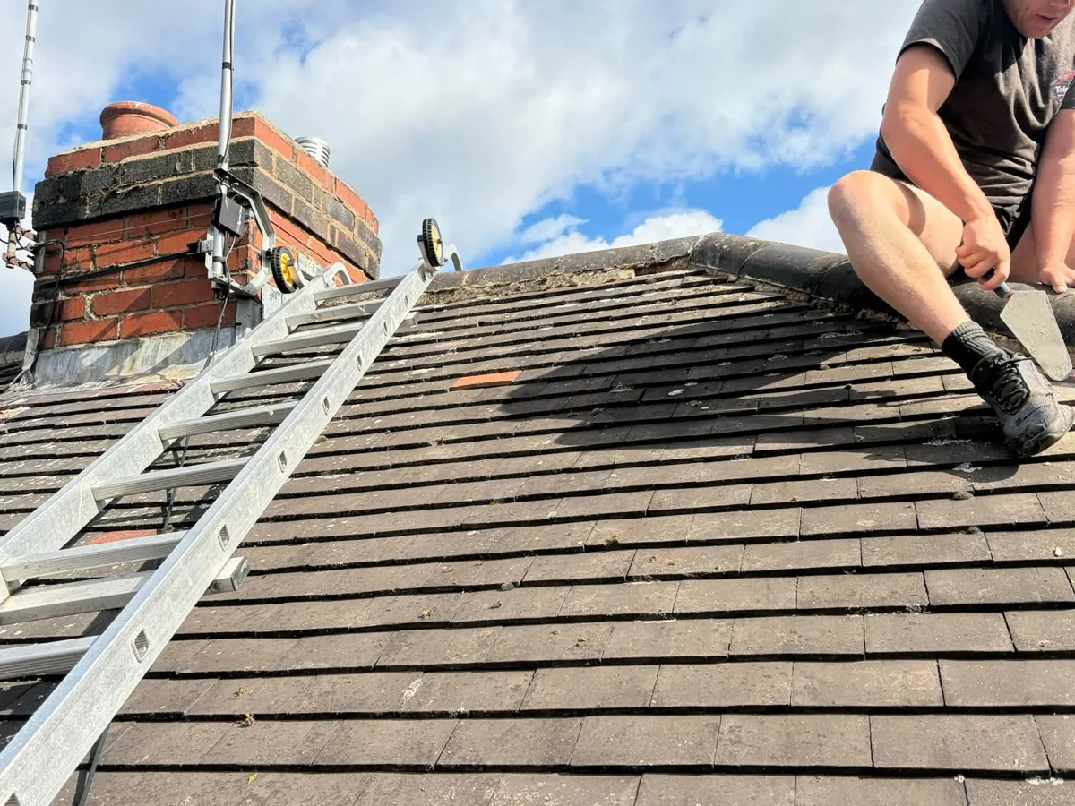 TripleT roofer working on ridge tiles
